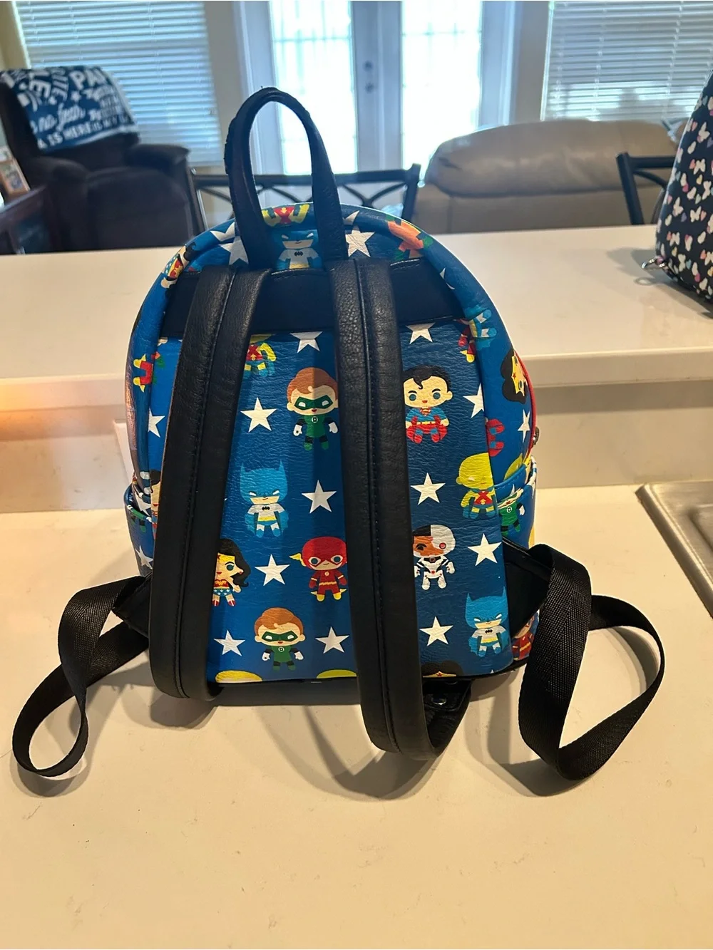 Loungefly Blue DC Kids Mini Backpack with Multicolor Superhero Print